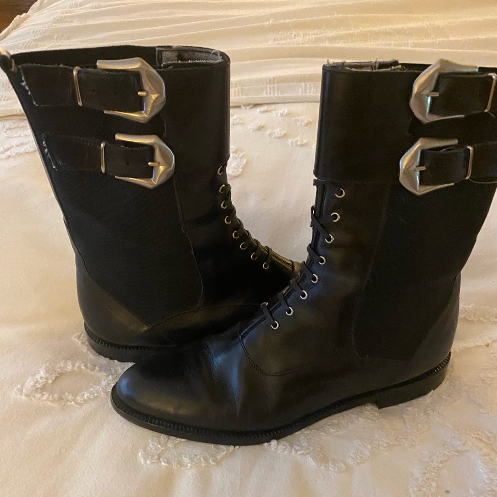 Black leather slip on half boots.